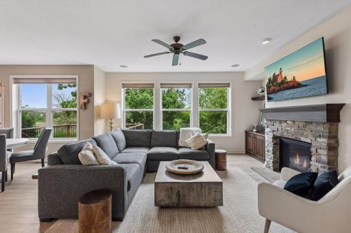 Expansive windows overlooking the backyard and wetlands.