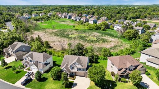 Set on a spacious lot backing to mature trees and tranquil wetlands.