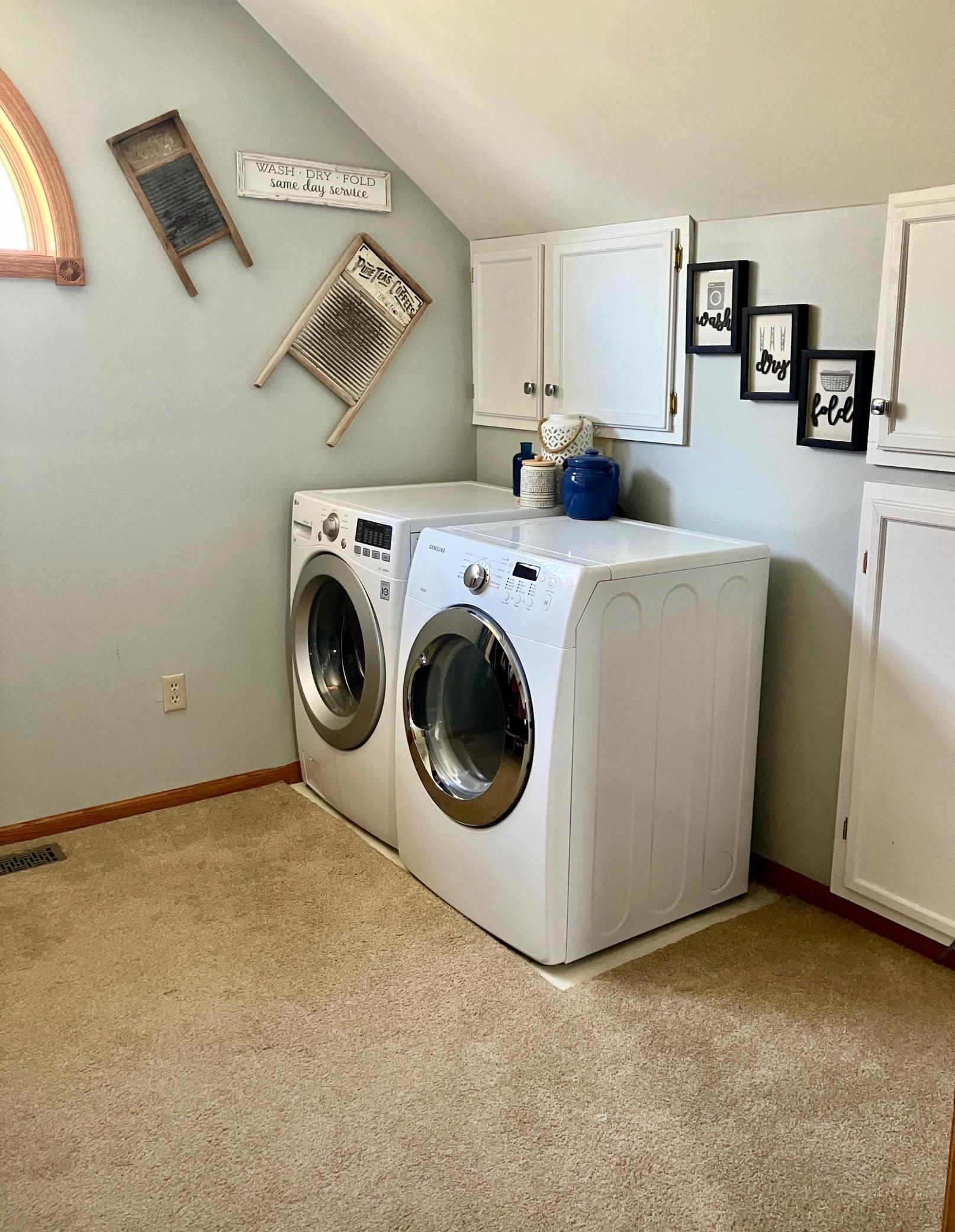 Laundry in walk in closet in primary bedroom