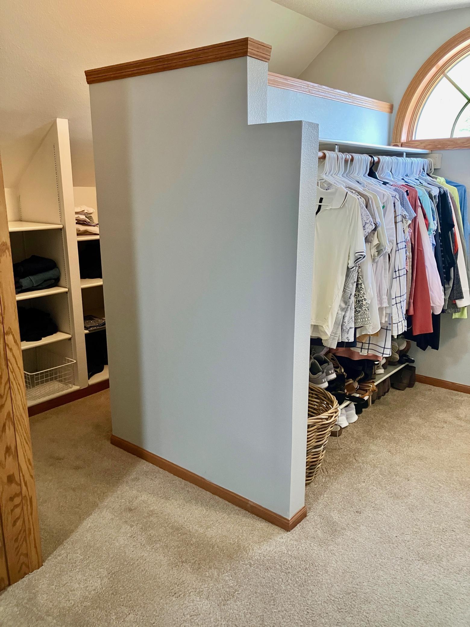 Walk in closet in primary bedroom