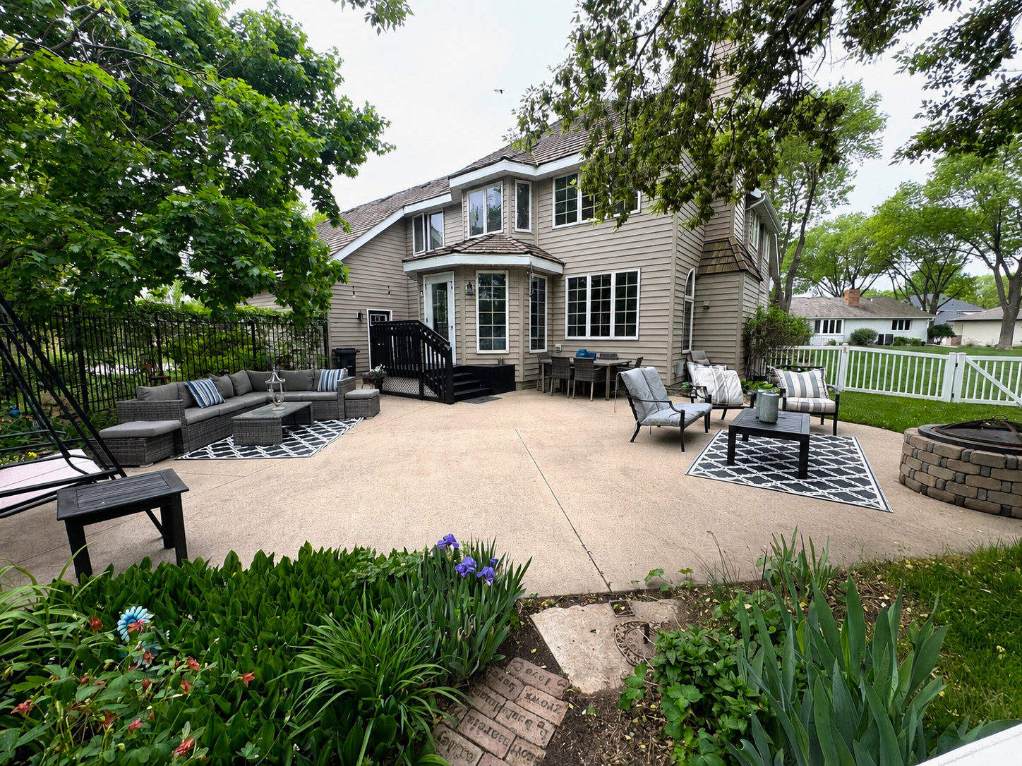 Patio area surrounded by landscaping