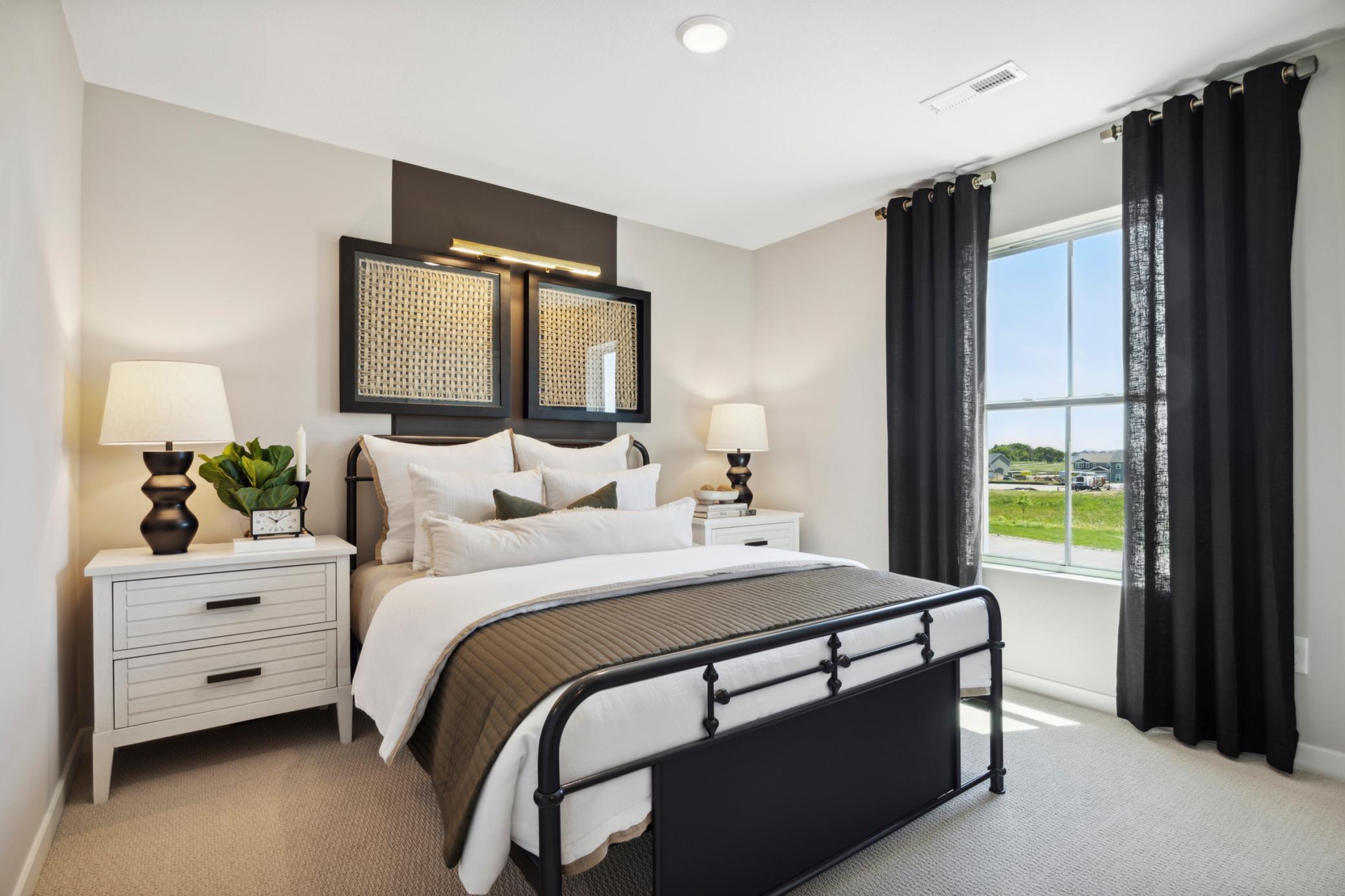 Thoughtfully proportioned layout provides plenty of space for a bed, nightstands, and a dresser, while maintaining an open, uncluttered feel.