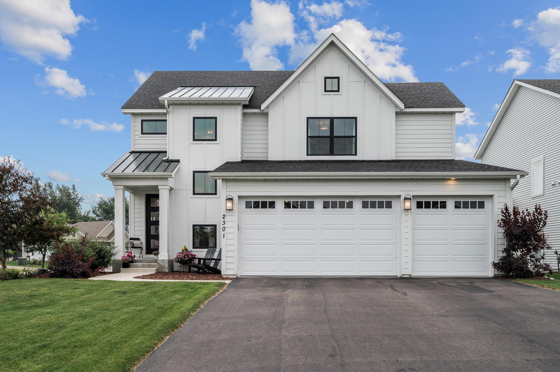 This is the Newport floor plan, one of the more efficient two-story layouts in the community at a competitive price point! Note how sharp the home looks with the white siding and black windows. Don't miss the 10-foot garage doors!