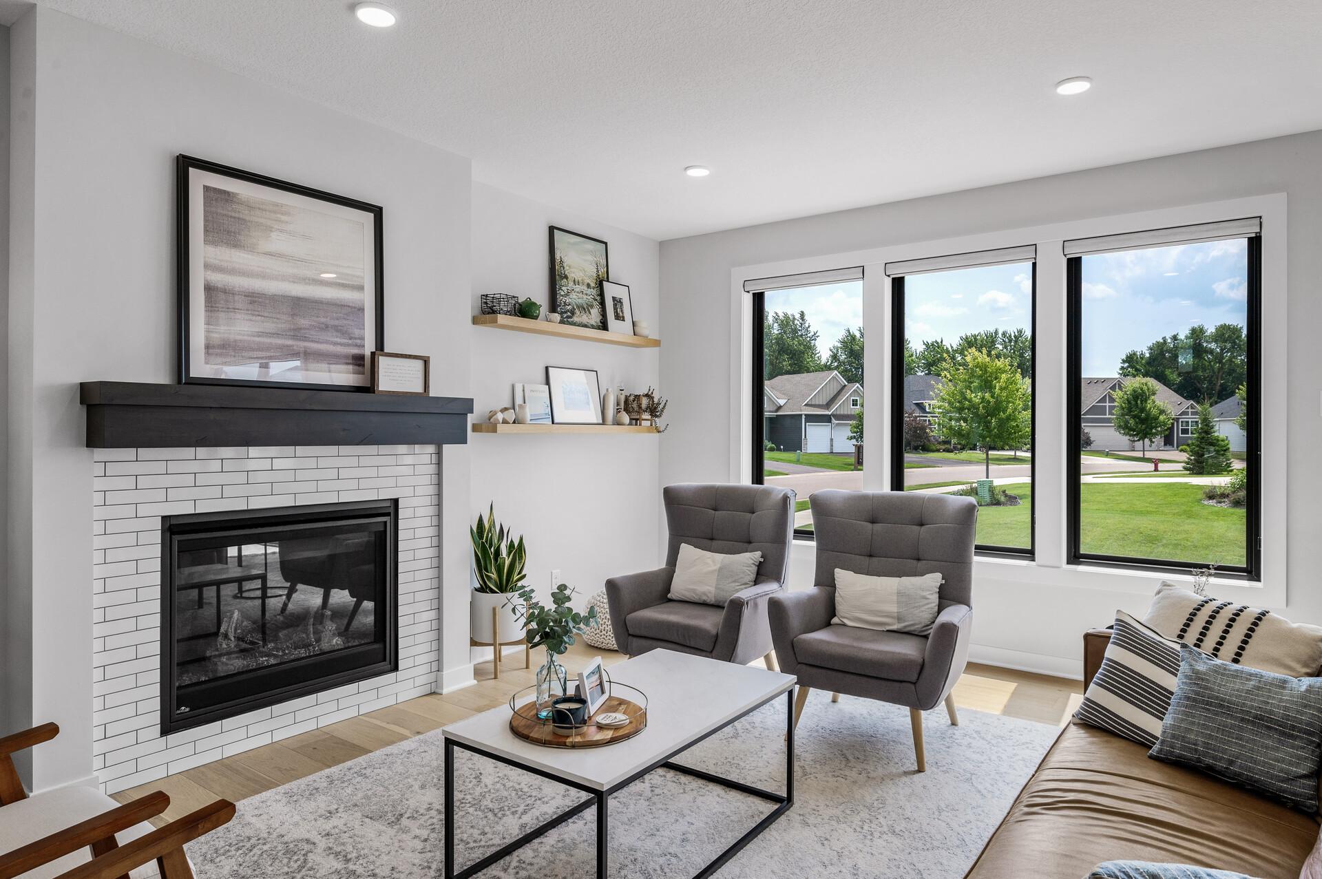 Oversized windows bring in a ton of natural light, custom shades for when you dont need it! Gas fireplace for those long Minnesota winters.