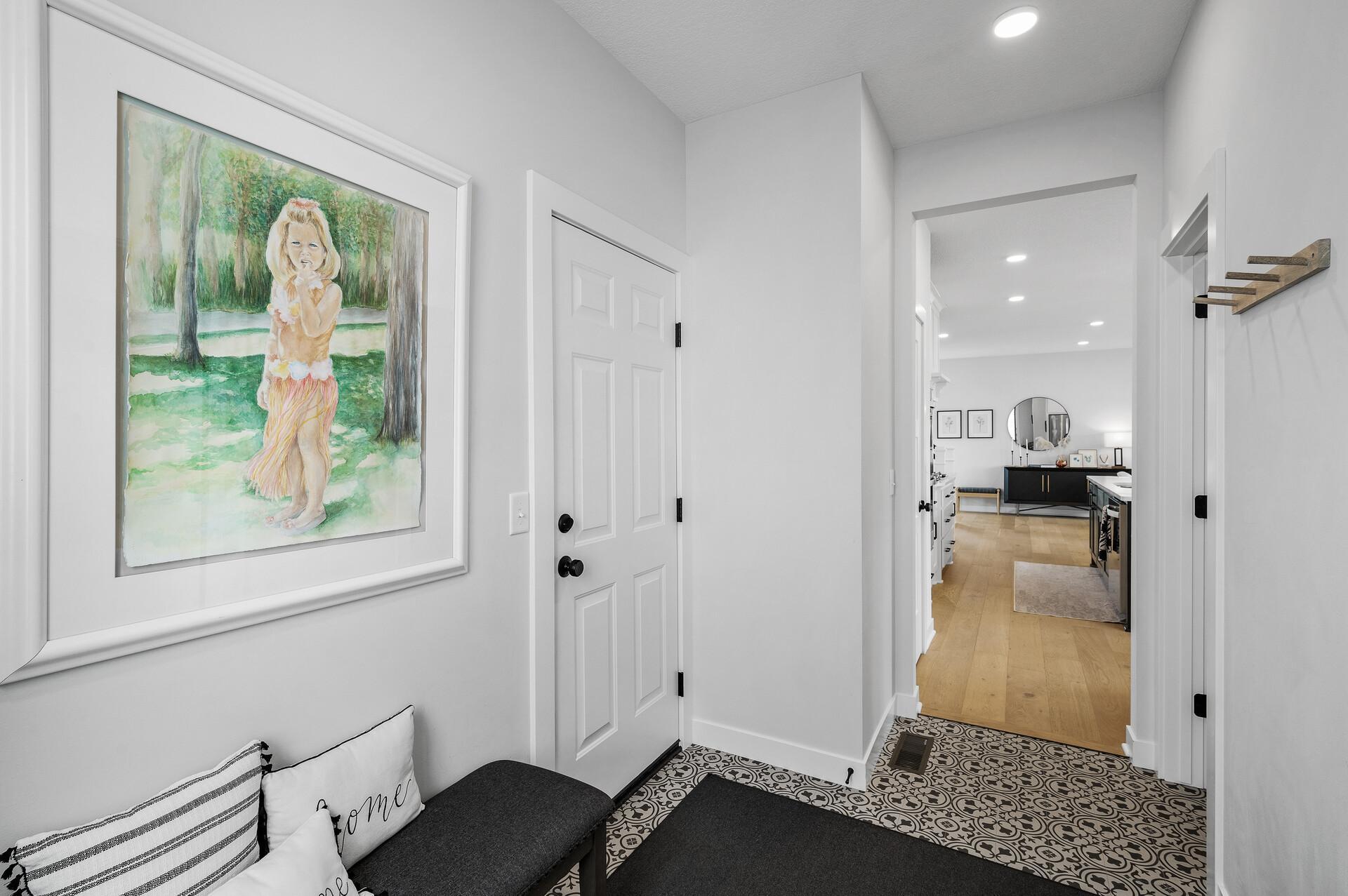 Behind this door is your three car garage! Kick off your shoes here and put them away in your coat closet.