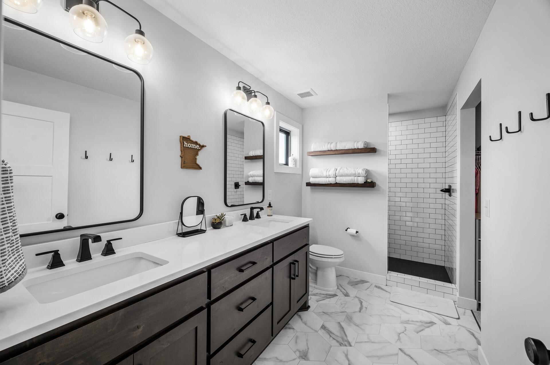 Primary bathroom features double sinks and upgraded tile shower!