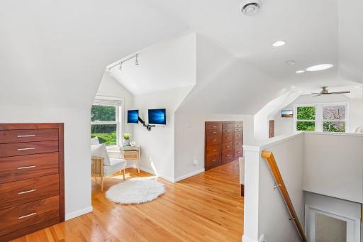 Upstairs, you enter a stunning and spacious lofted primary suite, beautifully designed with multiple sitting nooks and clever built-in storage areas