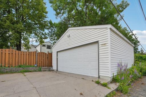 Built in 2006, the two-car garage features gated access to the backyard, equipped with an integrated kayak hoist system for perfect overhead watercraft storage. Enhanced with exterior motion lighting and a security camera for added peace of mind