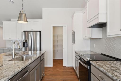 Photo is of a different home (same model) - colors and selections may vary.