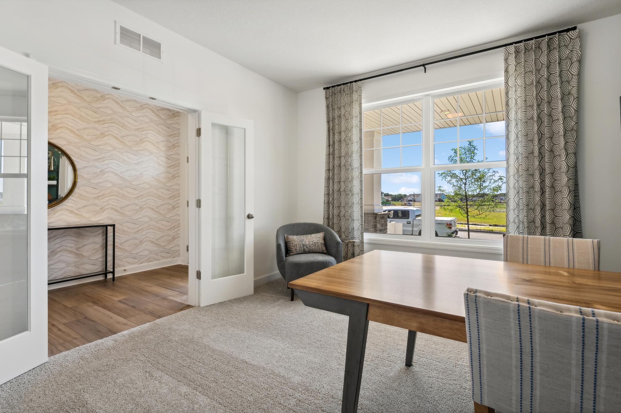 (Photo of decorated model, actual home's finishes will vary) Perfect for an office space or recreation room, this flex space is well-suited for the unique needs of any homeowner.