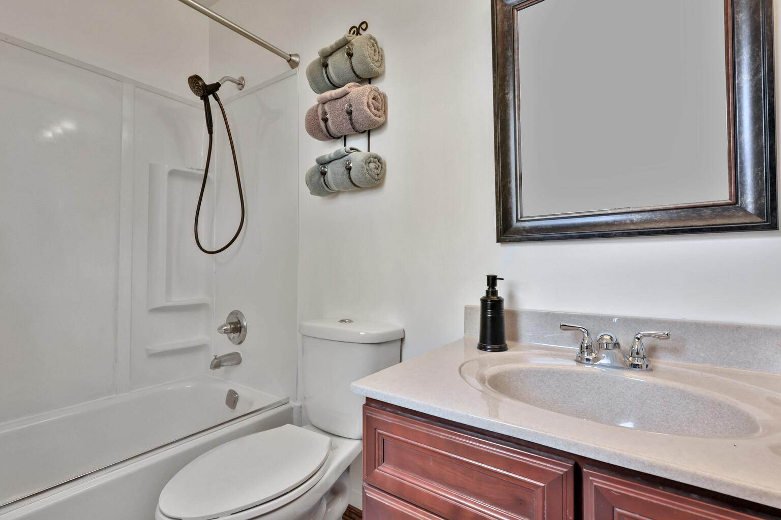 Full bath with shower head, Dual 1500 gallon holding tanks for septic. (No big ugly mound in the back yard)