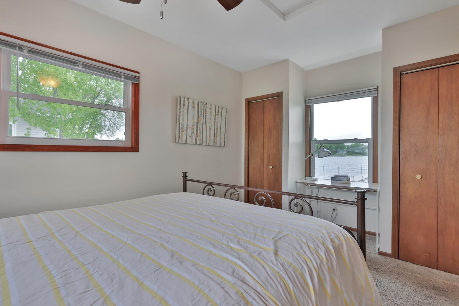 Larger bedroom with view of the lake. dual closets.