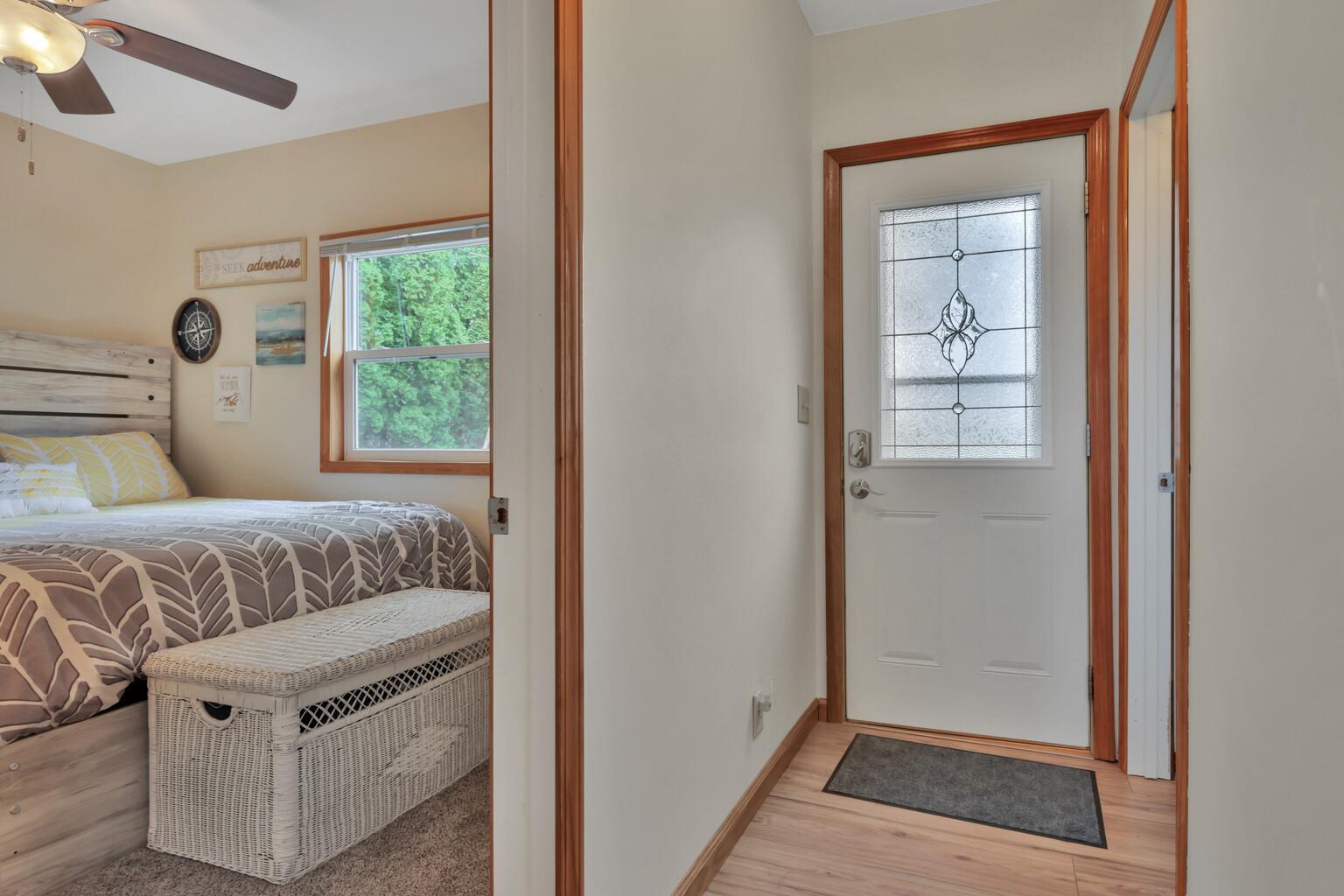 Back door entry (opposite the lake) with second bedroom to left and full bath to the right.