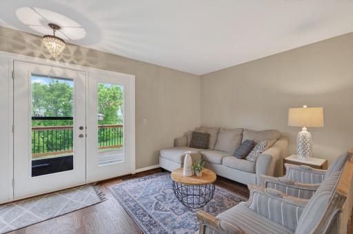 Living Room with Deck Access ( Bonus: Couch Can Stay!! )