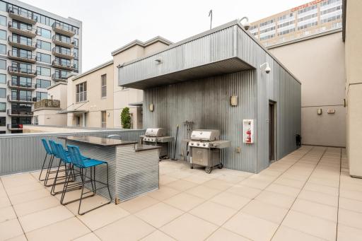 The community rooftop include this great grilling and bar seating area with plenty of space to gather outdoors