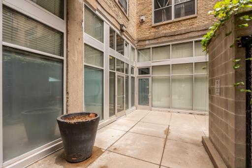 This door conveniently located right passed the mailboxes takes you through the courtyard to your garage door