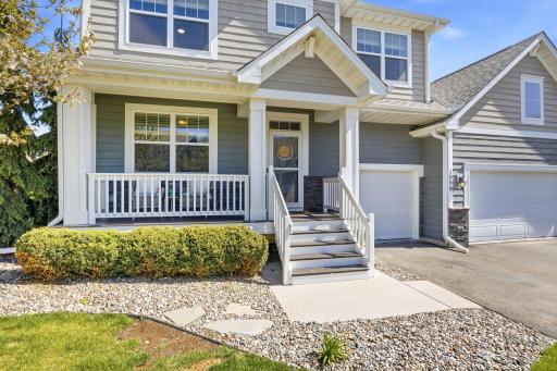 Charming covered front porch and inviting entry create the perfect welcoming first impression, accented by beautiful landscaping and timeless curb appeal