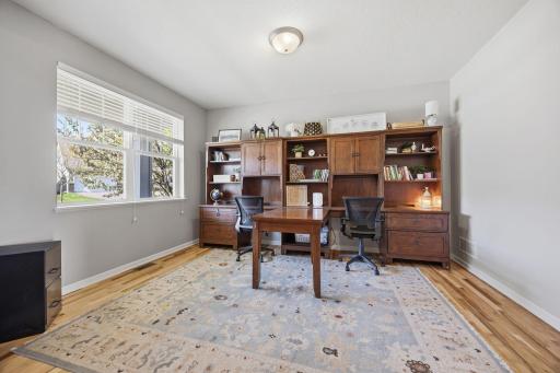 Versatile main-level office or flex room with large sun-filled window, ideal for working from home, studying, or creating a quiet retreat.