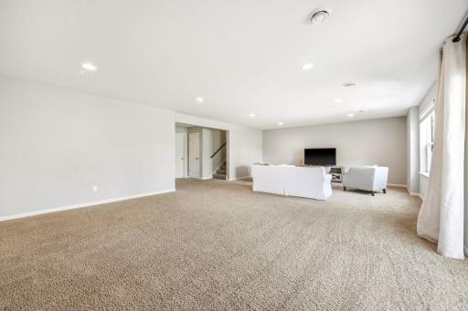 Huge finished lower level offers endless possibilities for a home theater, game room, fitness area, play space, or additional entertaining with an open and versatile layout.