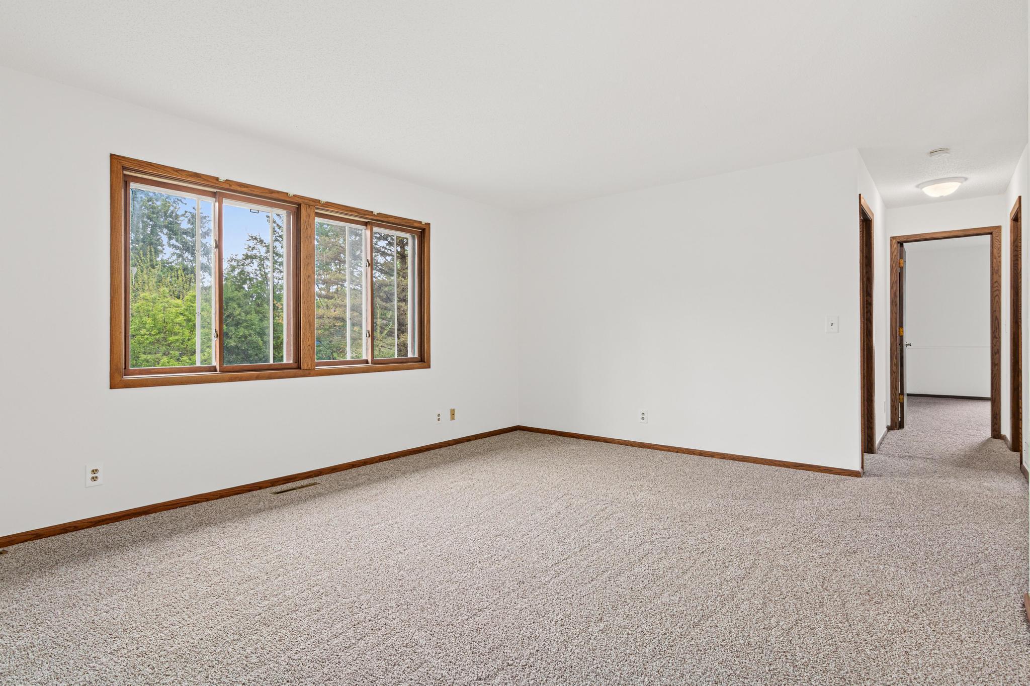 Another view of the living room as you enter the hallway to bedrooms.