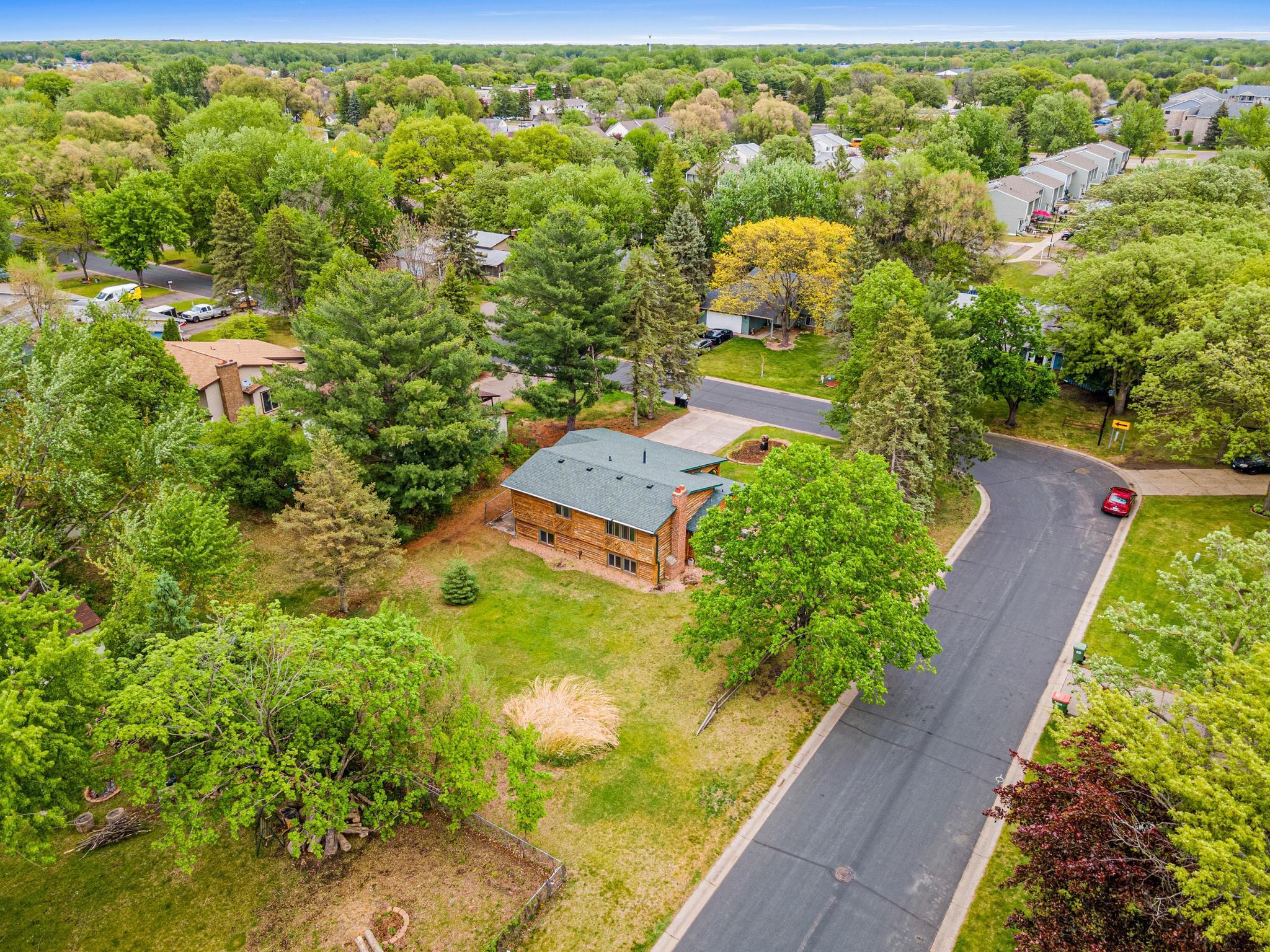 This large yard and corner lot has beautifully mature trees providing privacy.