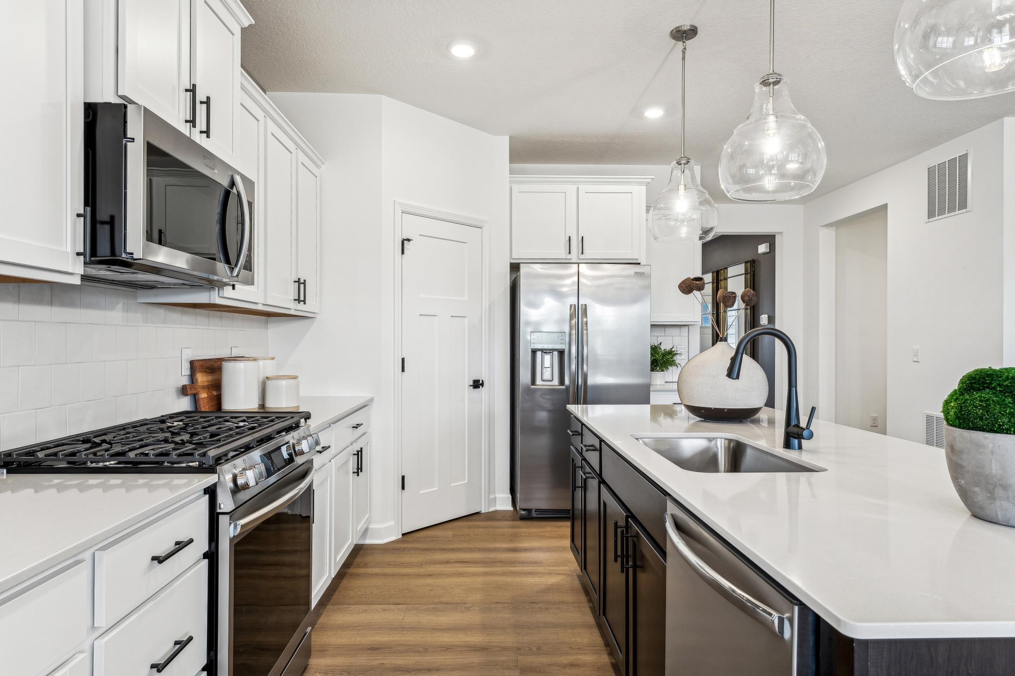 (Photo of a decorated model, actual homes finishes will vary) Tons of natural light with oversized windows.