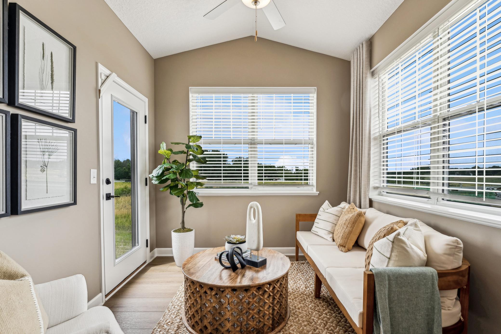 (Photo of a decorated model, actual homes finishes will vary) The four-season porch.