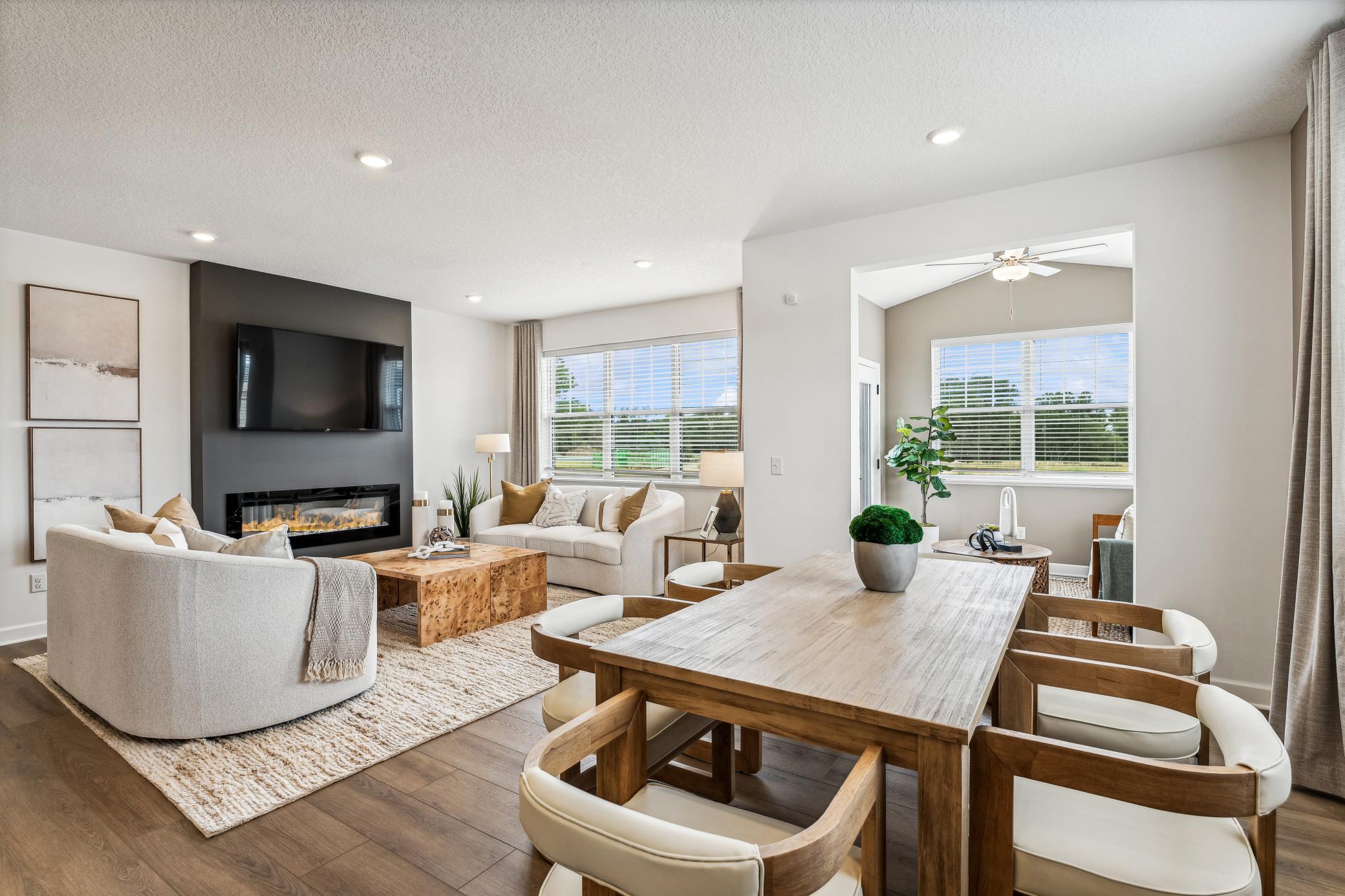 (Photo of a decorated model, actual homes finishes will vary) The main level has tons of natural light.