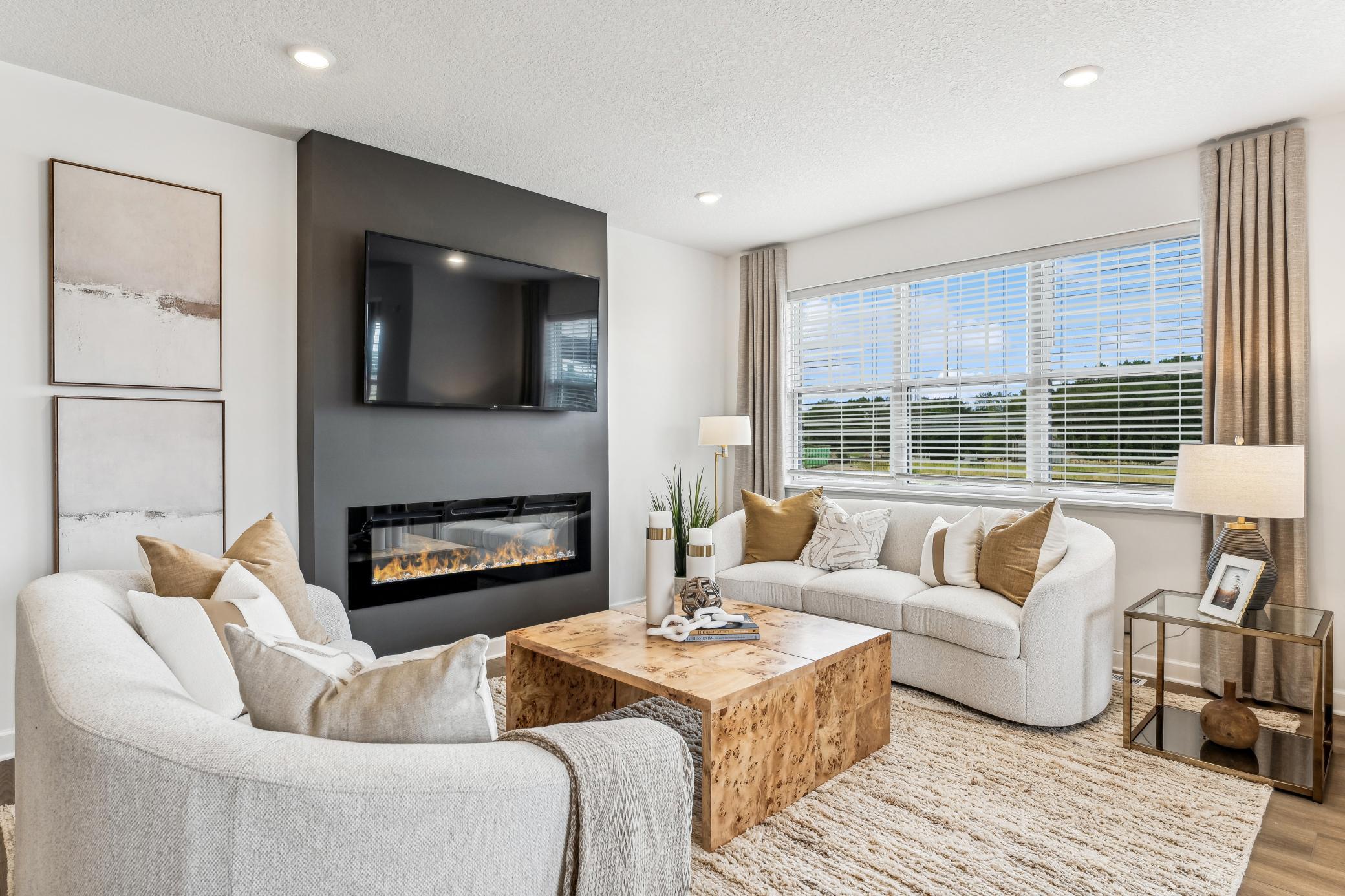 (Photo of a decorated model, actual homes finishes will vary) Cozy up next to the fireplace in your new Great Room.