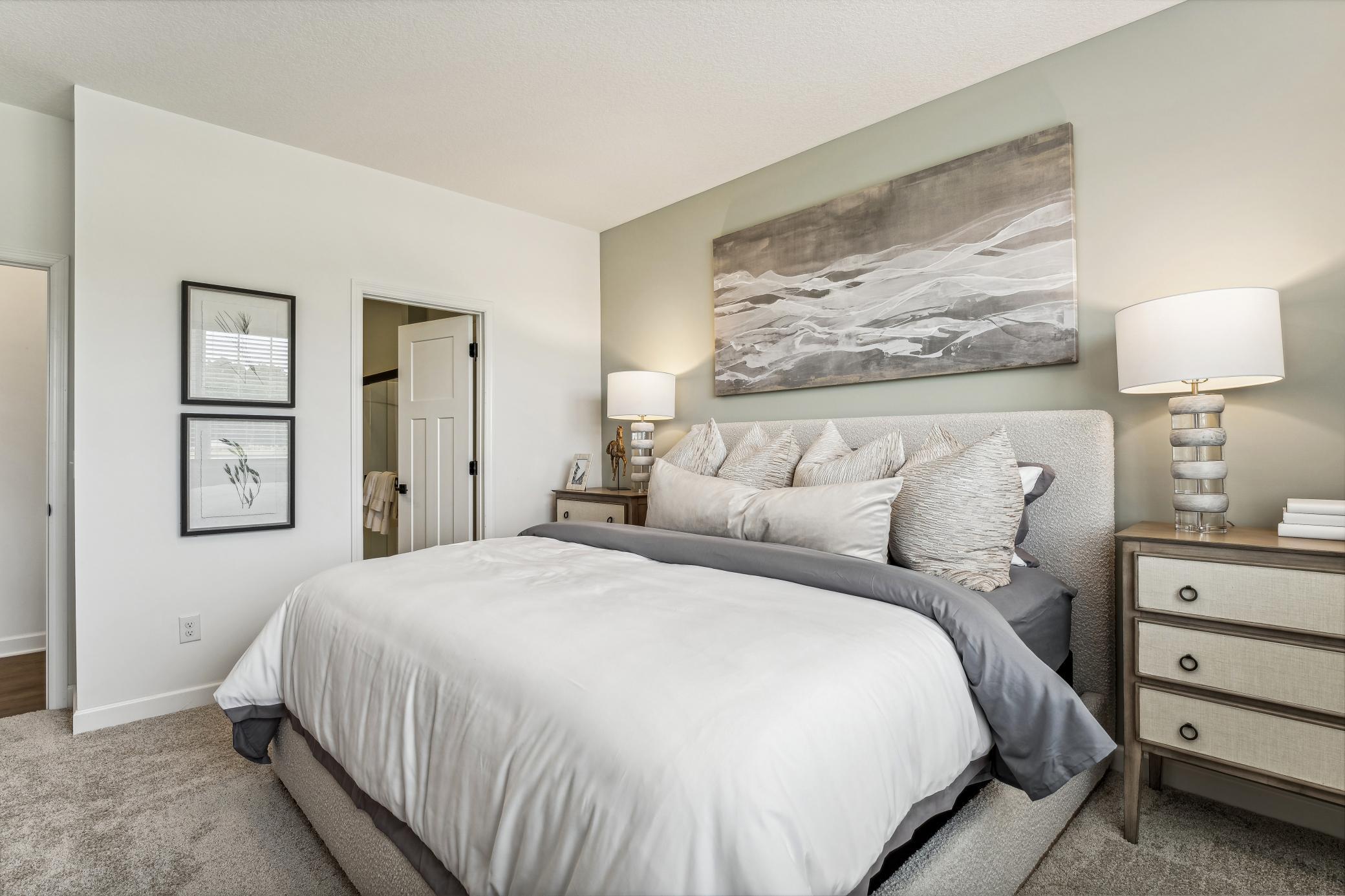 (Photo of a decorated model, actual homes finishes will vary) Find your retreat in the primary bedroom. Enjoy the exclusivity of a private bath and walk-in closet.
