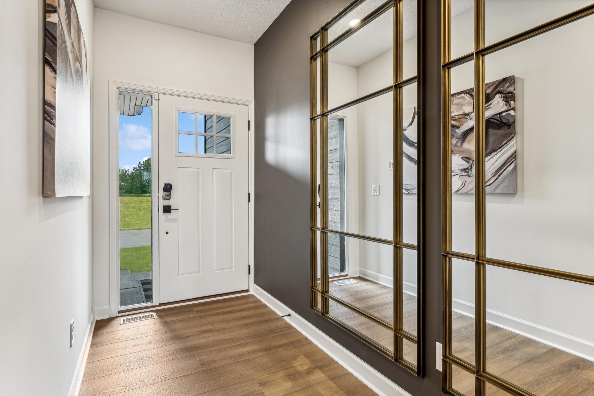 (Photo of a decorated model, actual homes finishes will vary) Make the best first impression with this bright and open foyer.