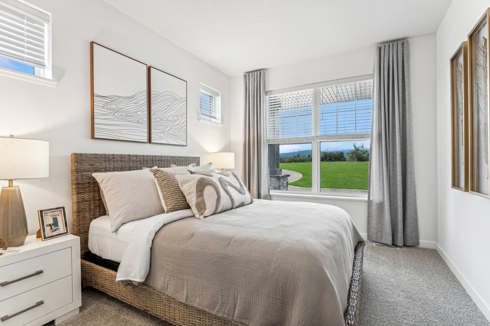 (Photo of a decorated model, actual homes finishes will vary) The secondary bedroom.
