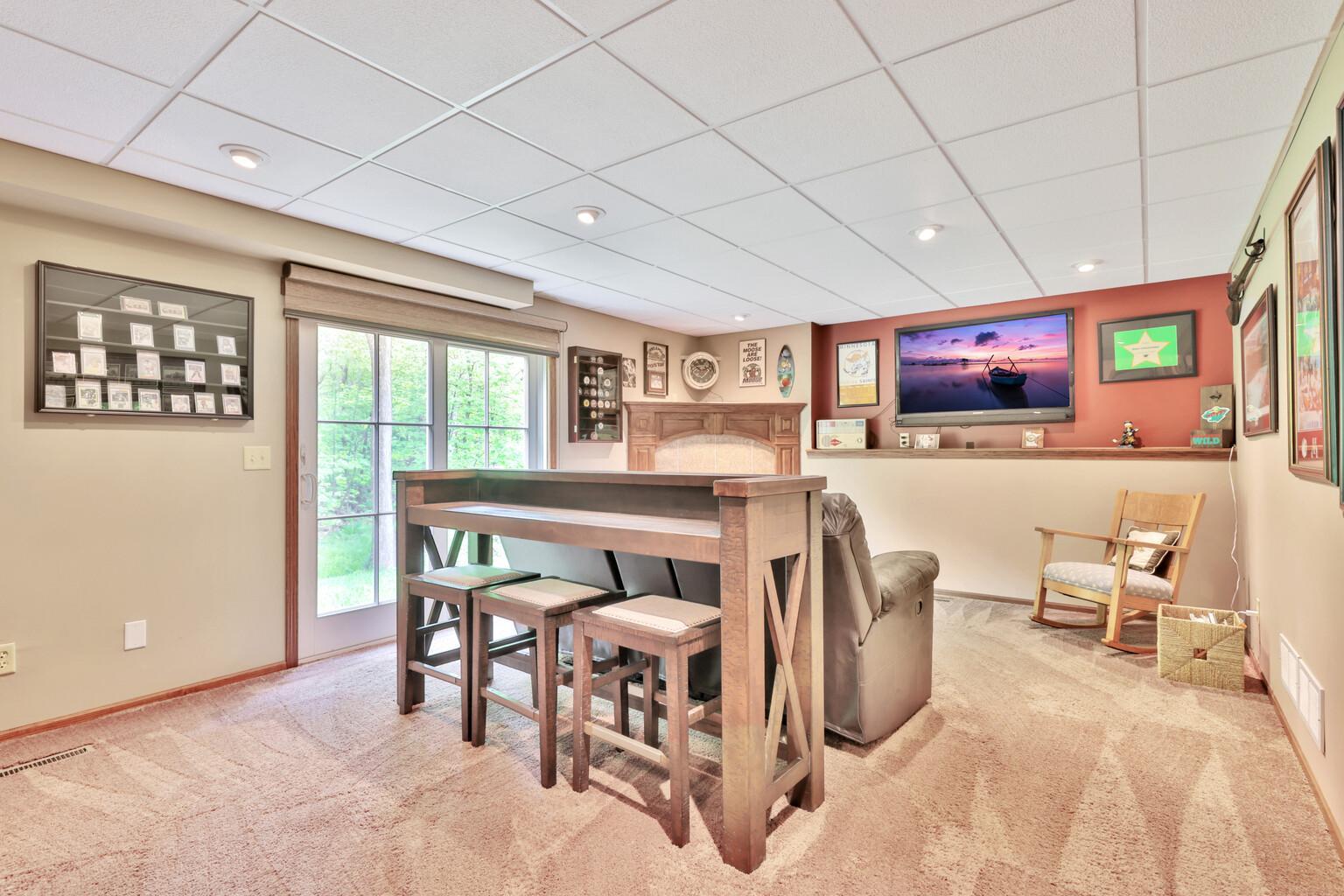 Lower Level Family Room with Walk Out and Gas Fireplace
