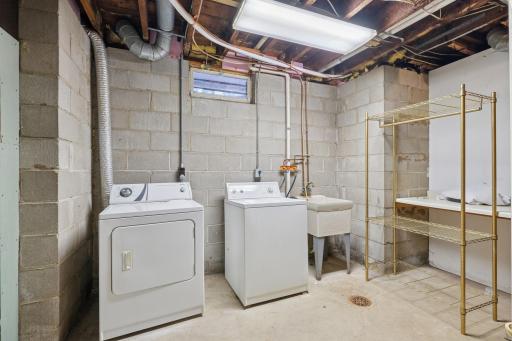 Separate laundry and utilities for both units and plenty of storage space.
