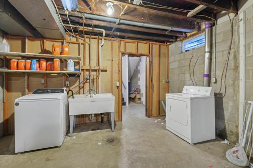 Separate laundry and utilities for both units and plenty of storage space.