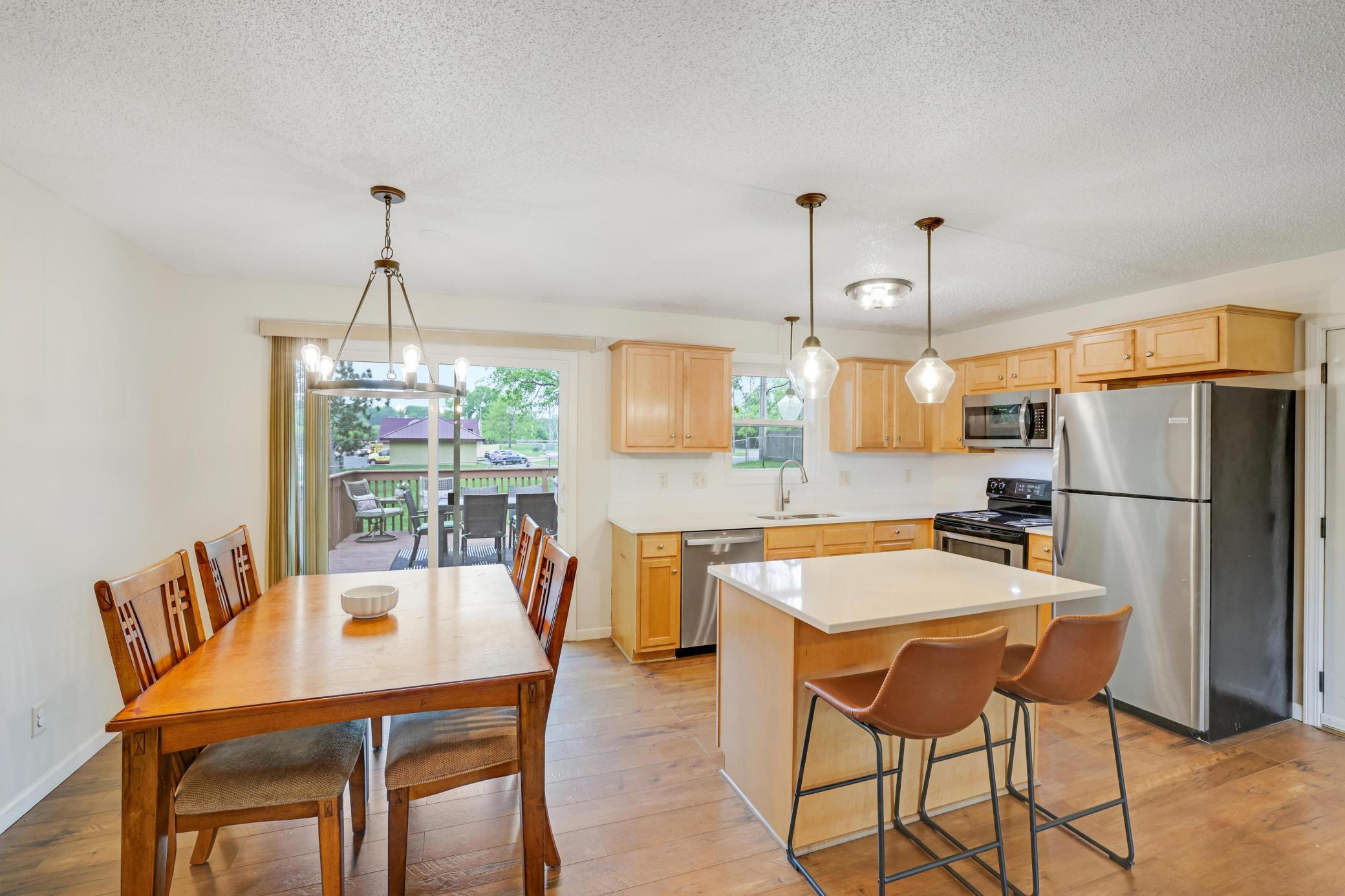 Informal dining area with access to deck and yard