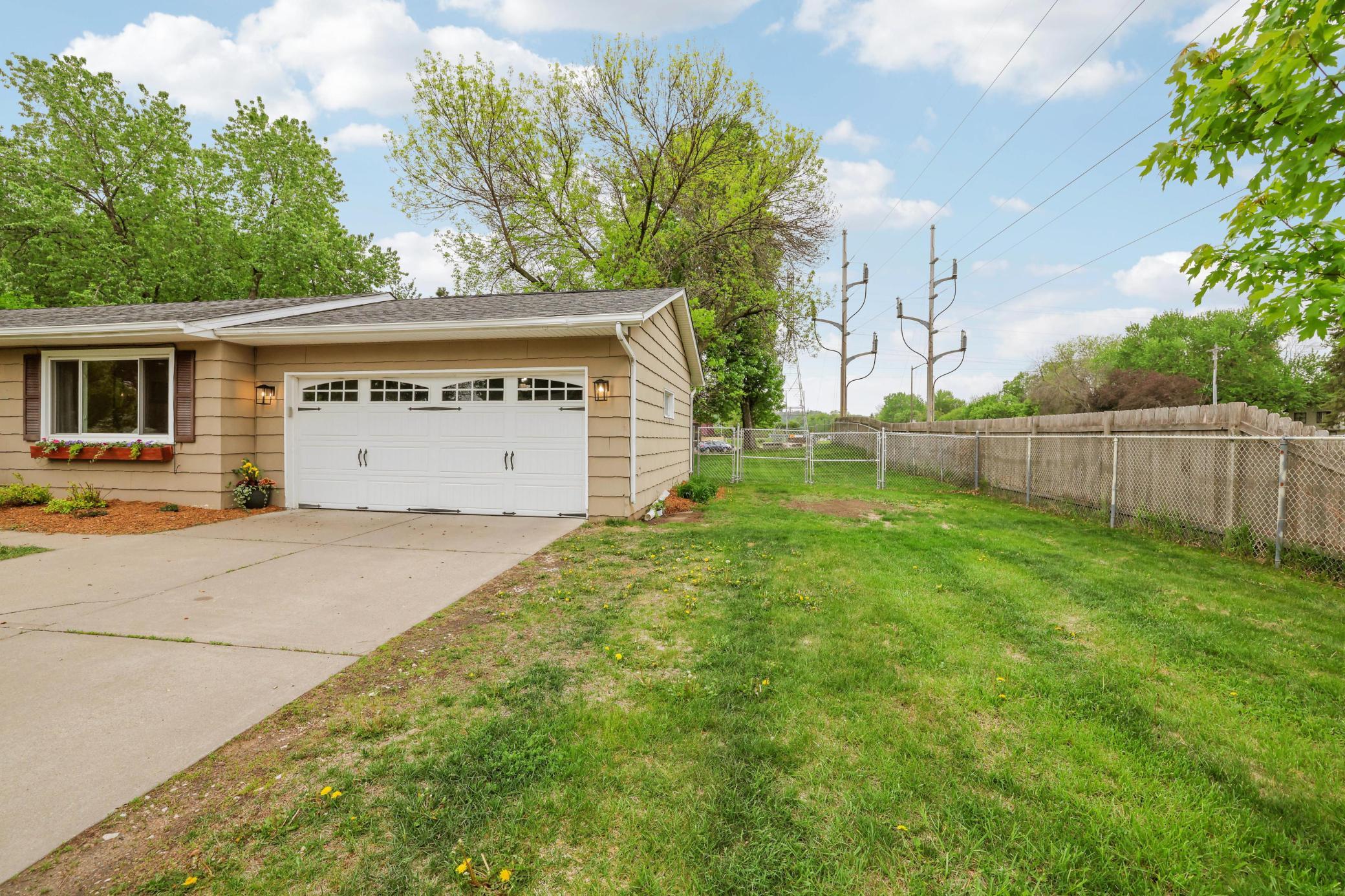 Extra parking on side of garage plus a double gate to the back yard