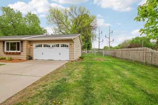 Extra parking on side of garage plus a double gate to the back yard