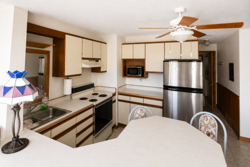 Great kitchen area that has lots of cabinet storage for your organization.
