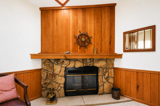 Close up of the stone fire place that is perfect for a cozy night in.