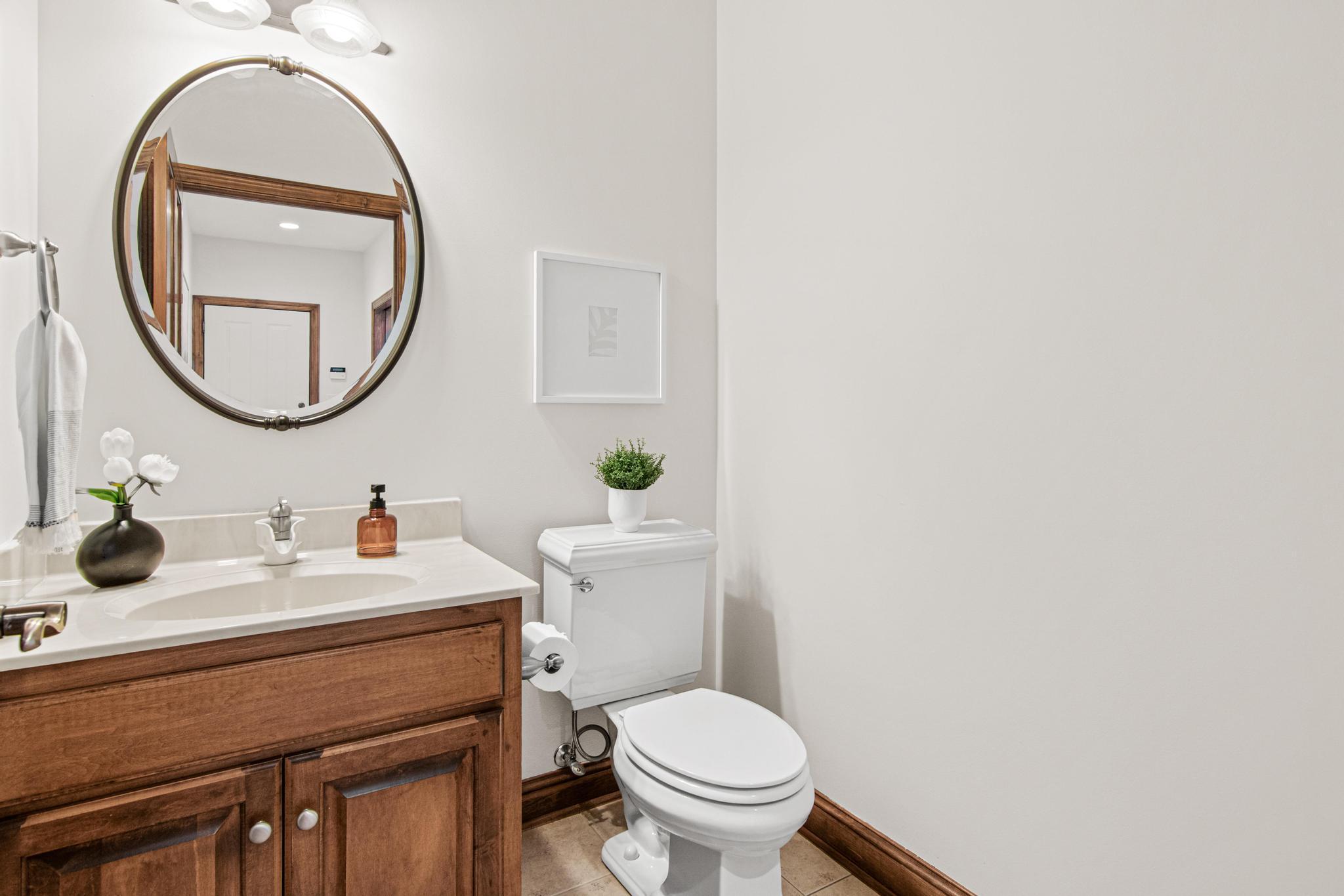 Main floor half bath that is conveniently located right off the kitchen.