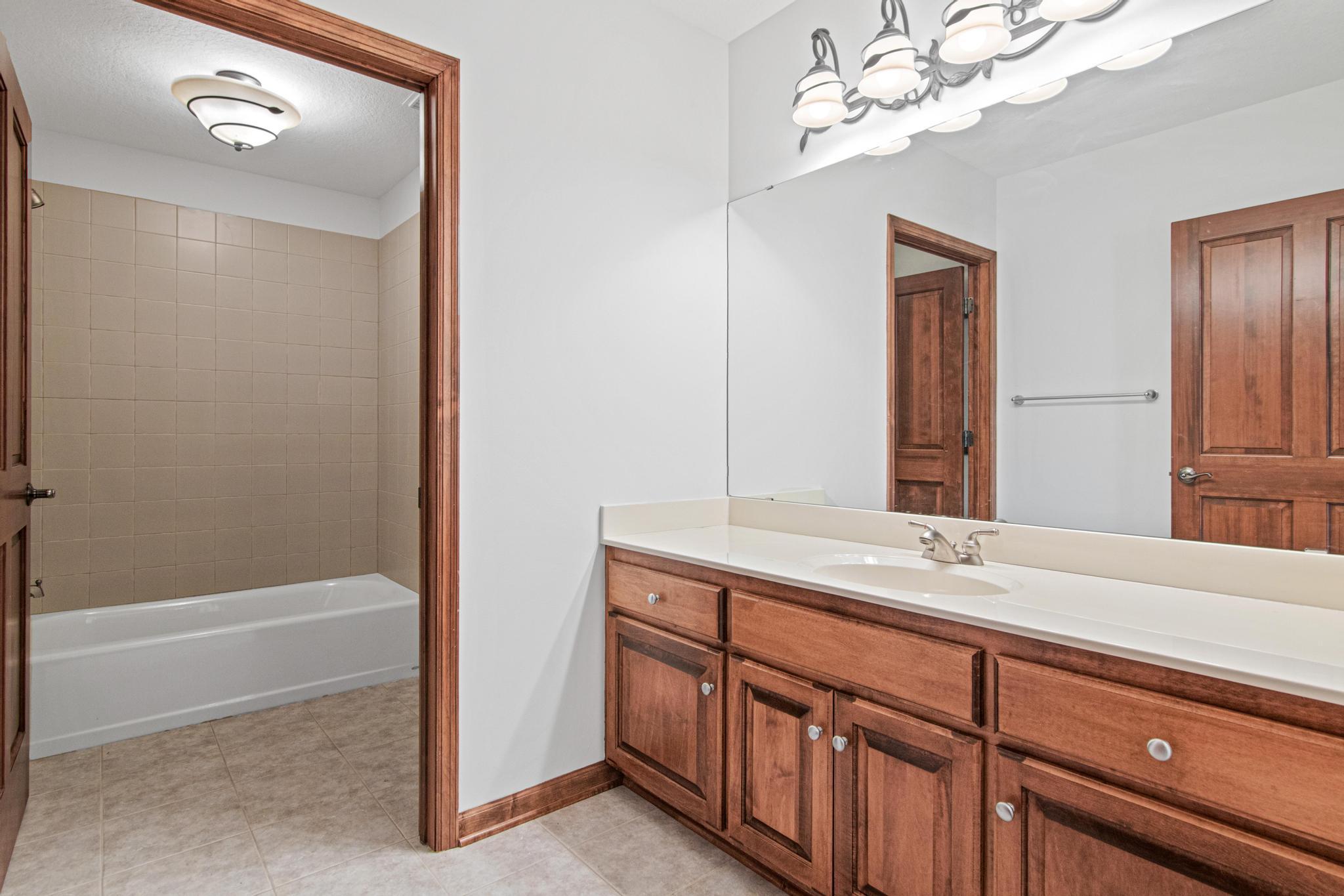 Lower level bathroom that is easily accessed by both lower bedrooms and the game room.