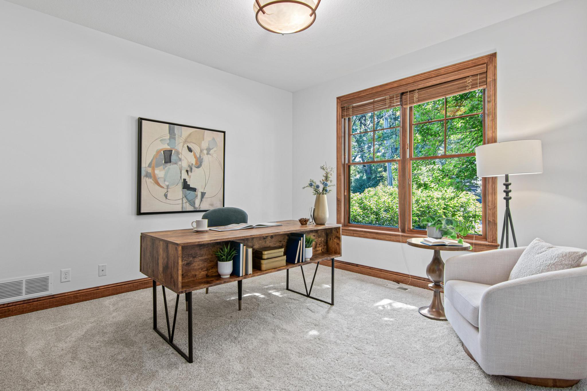 Second main level bedroom perfect for guests, or an office space.
