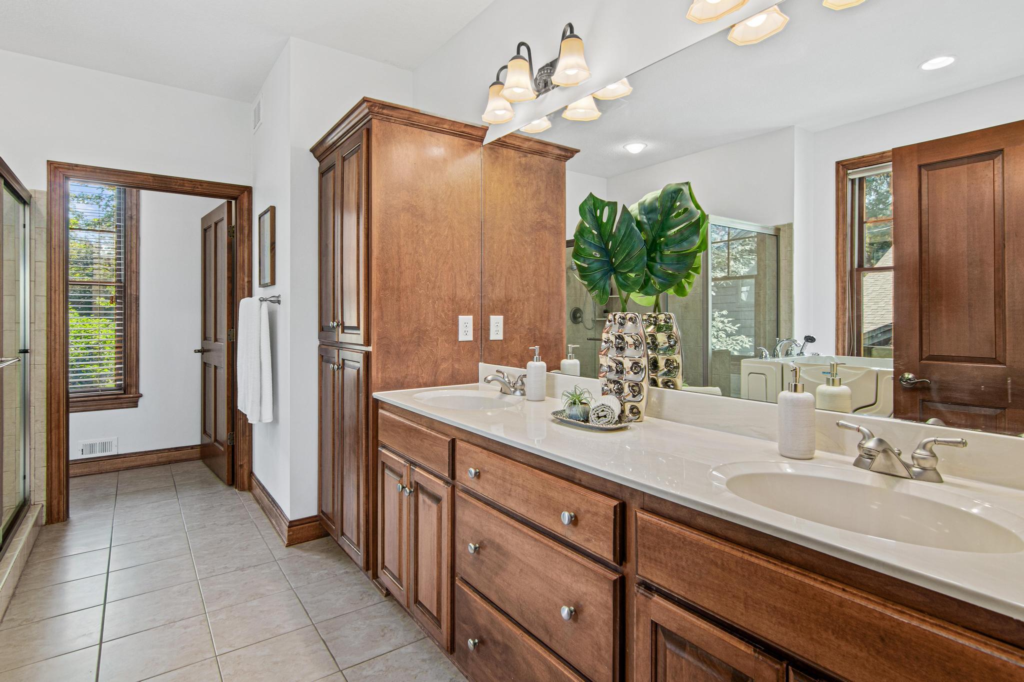 Dual sinks the primary bathroom allow for ease in getting ready in the mornings.