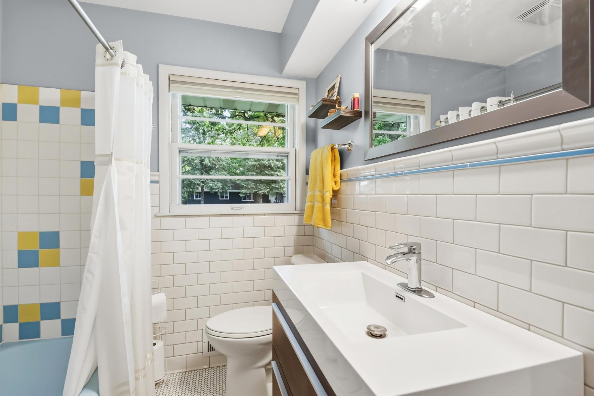 Main floor primary bath features infloor heat..jpg