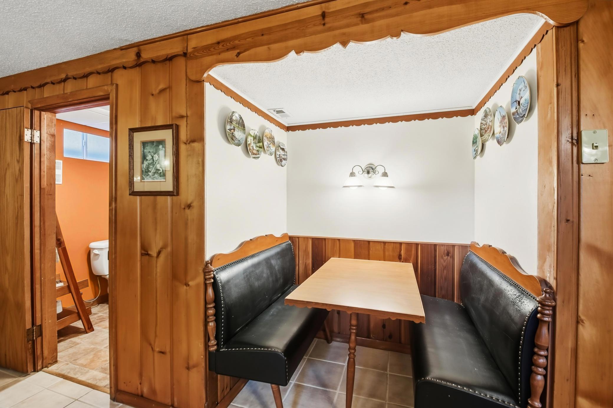 This cozy area offers warm wooden walls & flooring. Charming!!.jpg