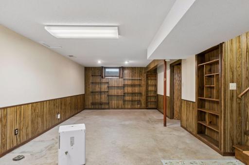 Family room in basement. Add carpet for instant equity.
