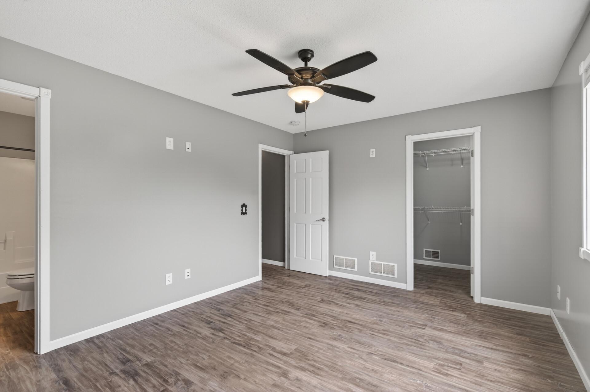 Primary bedroom with walk-in closet