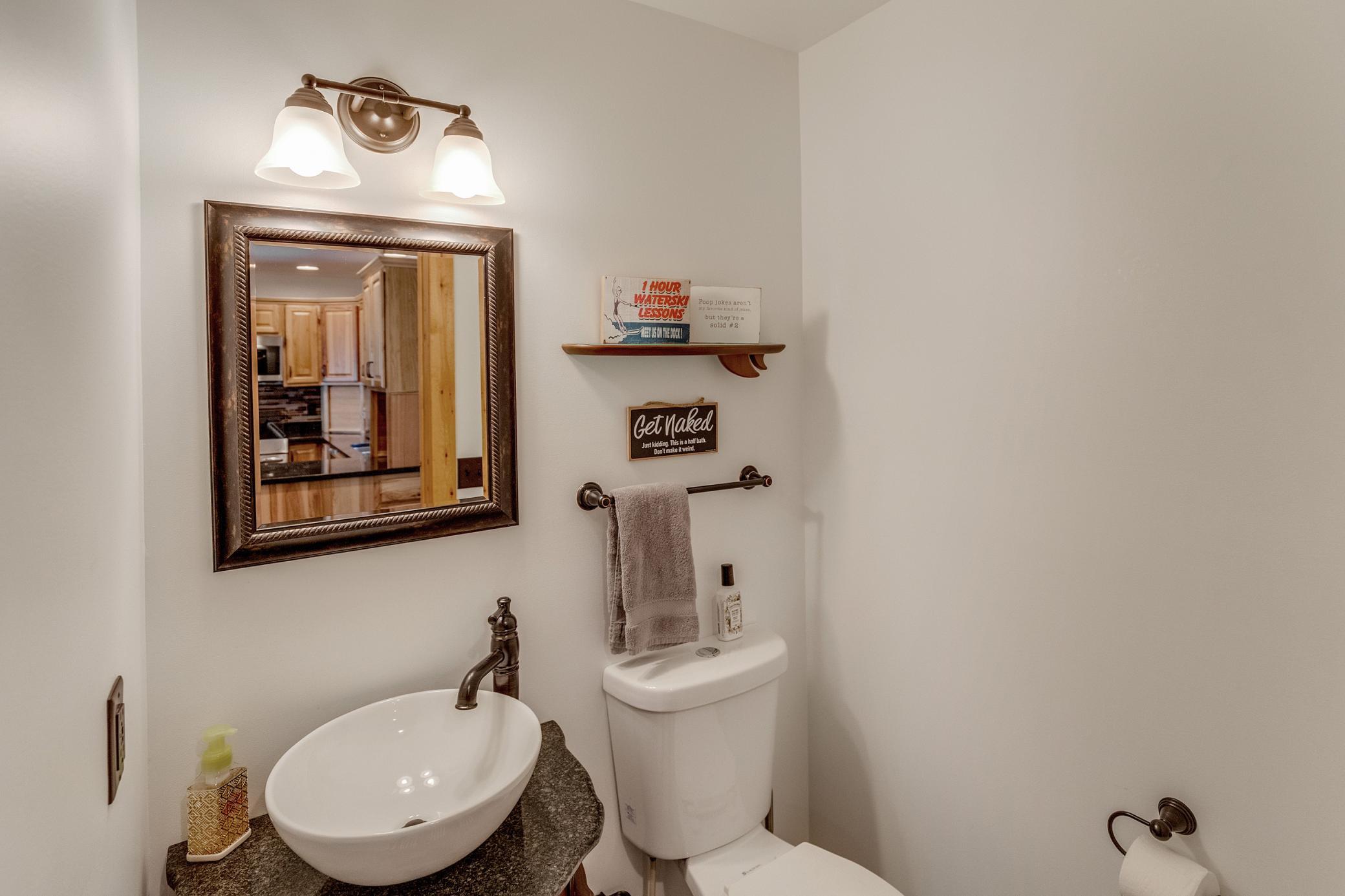 1/2 bath off of entry to House 1.