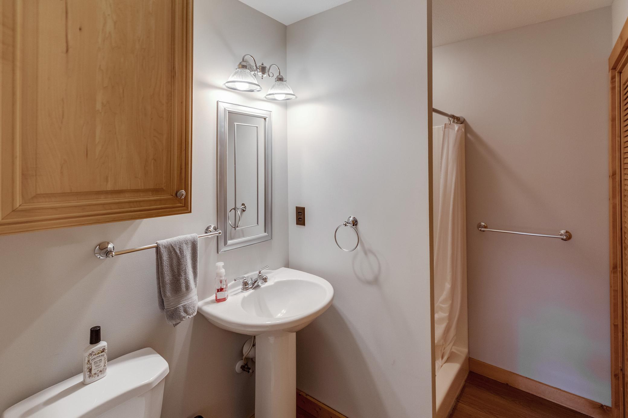 house 2 bathroom with laundry closet.